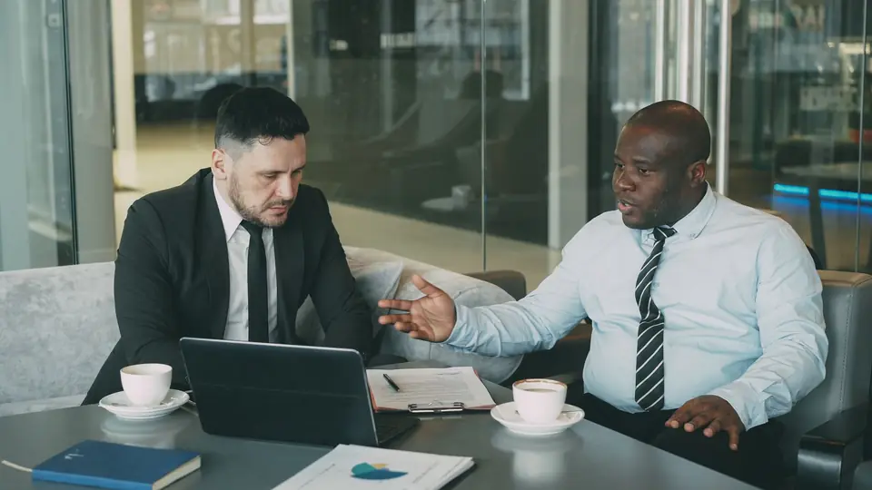 Business professionals discussing strategy in a corporate meeting